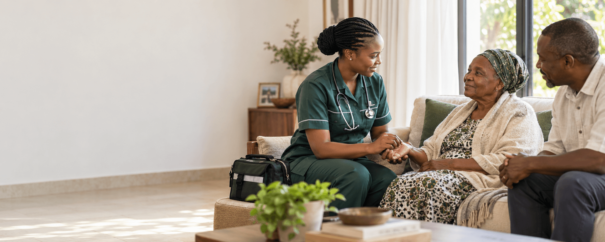 Healthcare professional visiting a patient and family at home